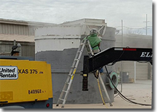 Primer being sprayed on a steel tank.